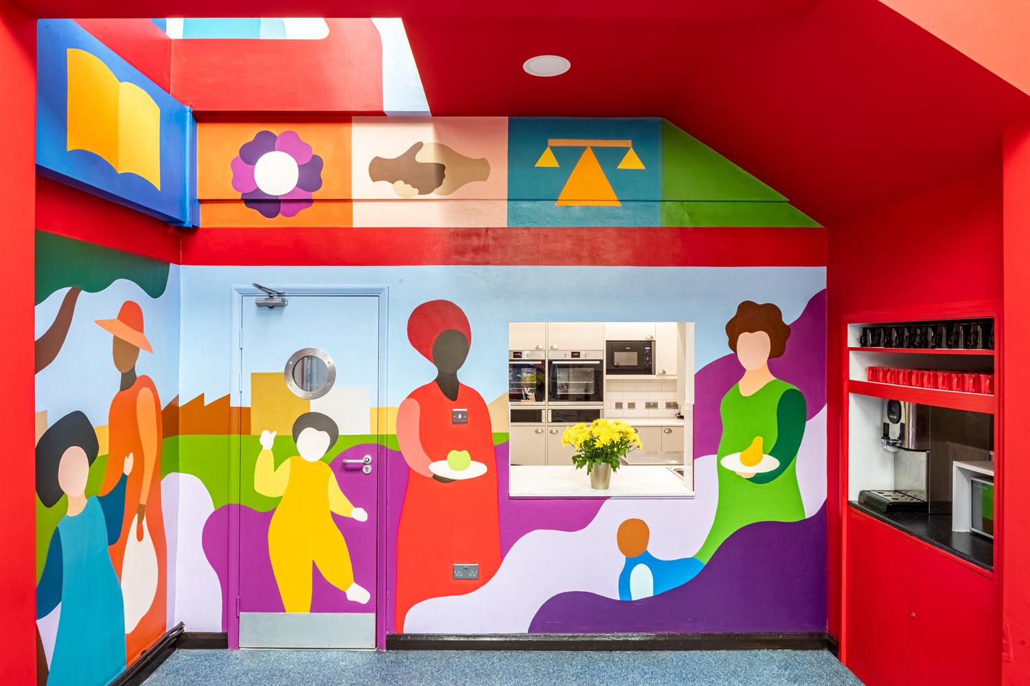 Community centre interior space with colorful mural