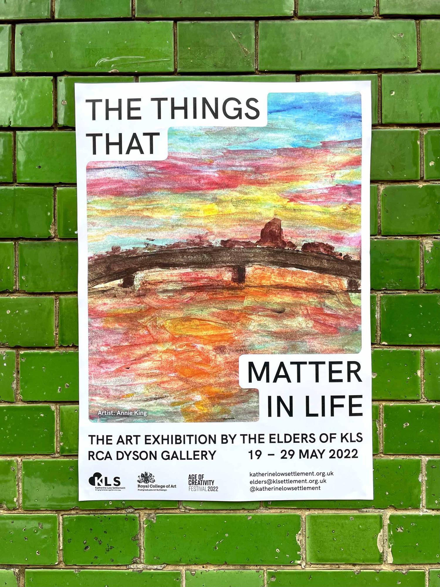 Exhibition poster with colorful drawings and black and white typography on green brick wall